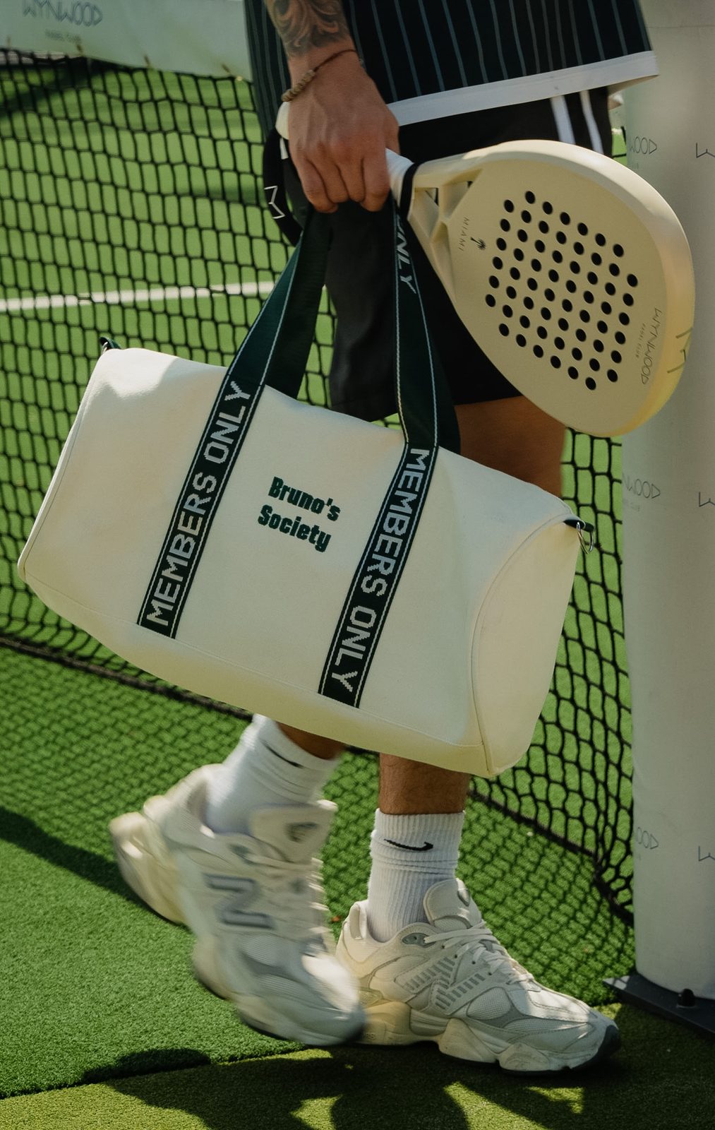 Society Duffle Bag being carried across the padel court