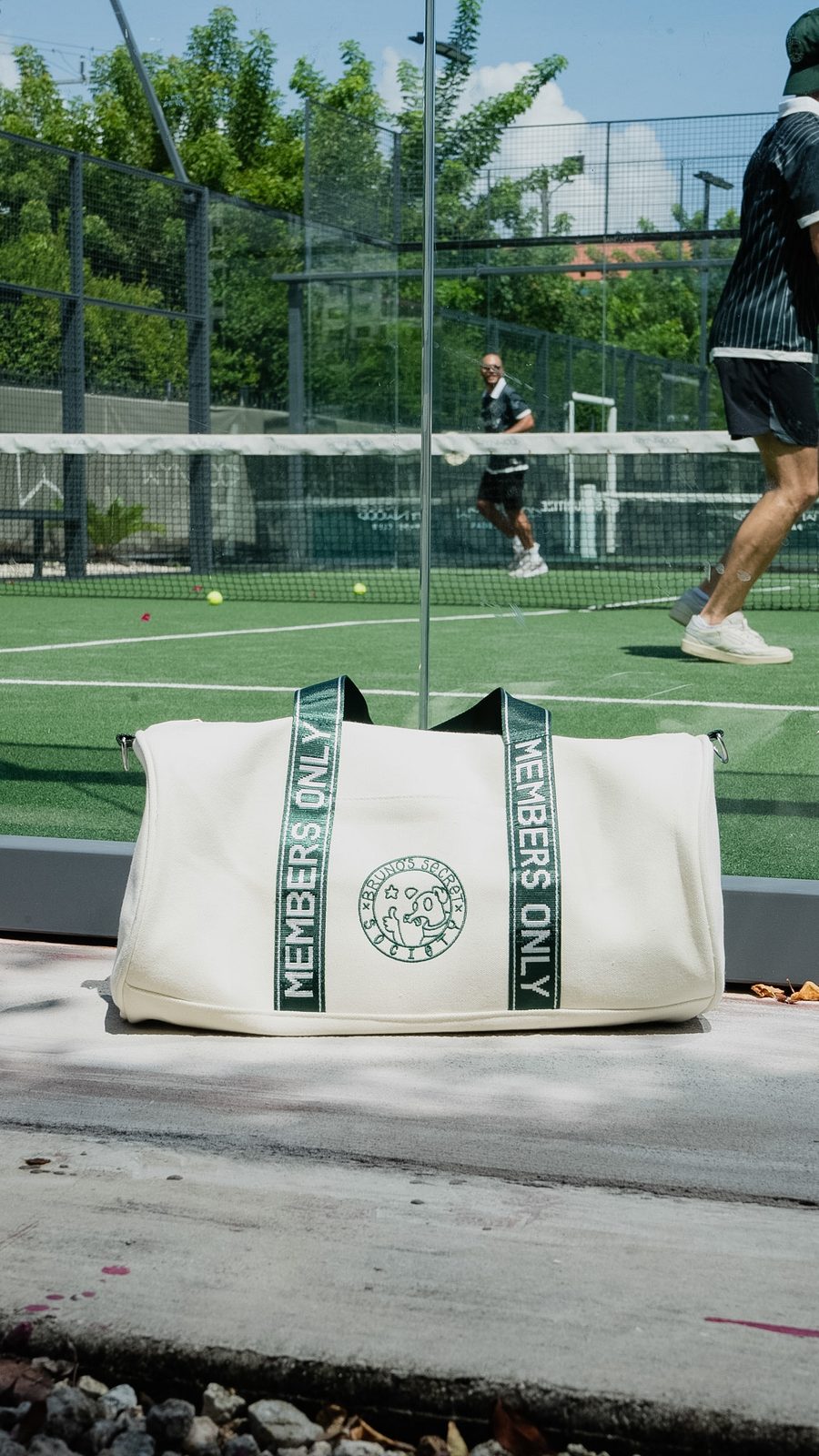 Society Duffle Bag — cream canvas with dark green MEMBERS ONLY jacquard straps and embroidered seal