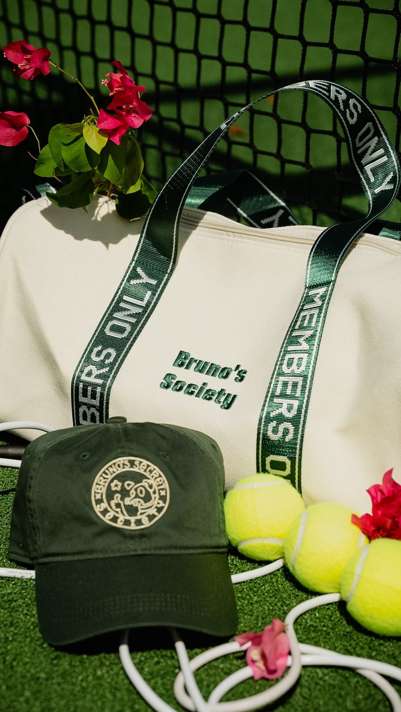 Society Duffle styled with tennis balls and flowers