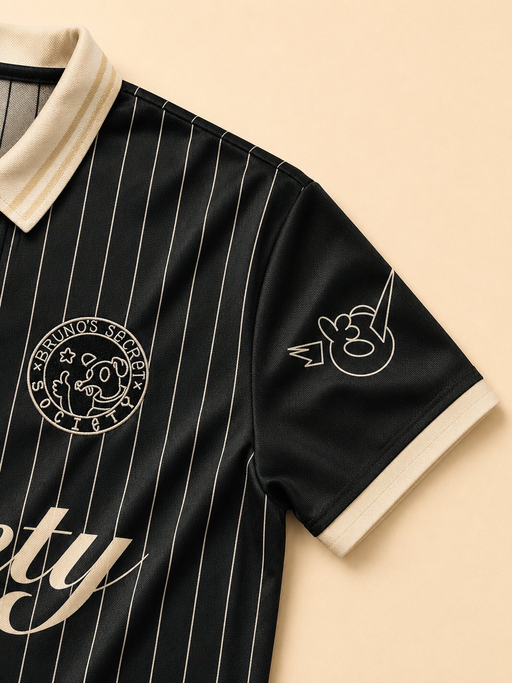 Embroidered chest seal and sleeve print on the Society Jersey